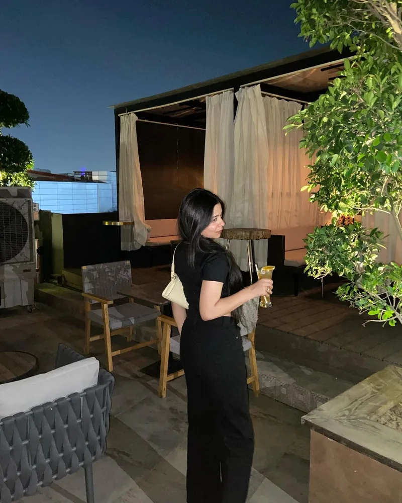 A creator on a terrace at night
